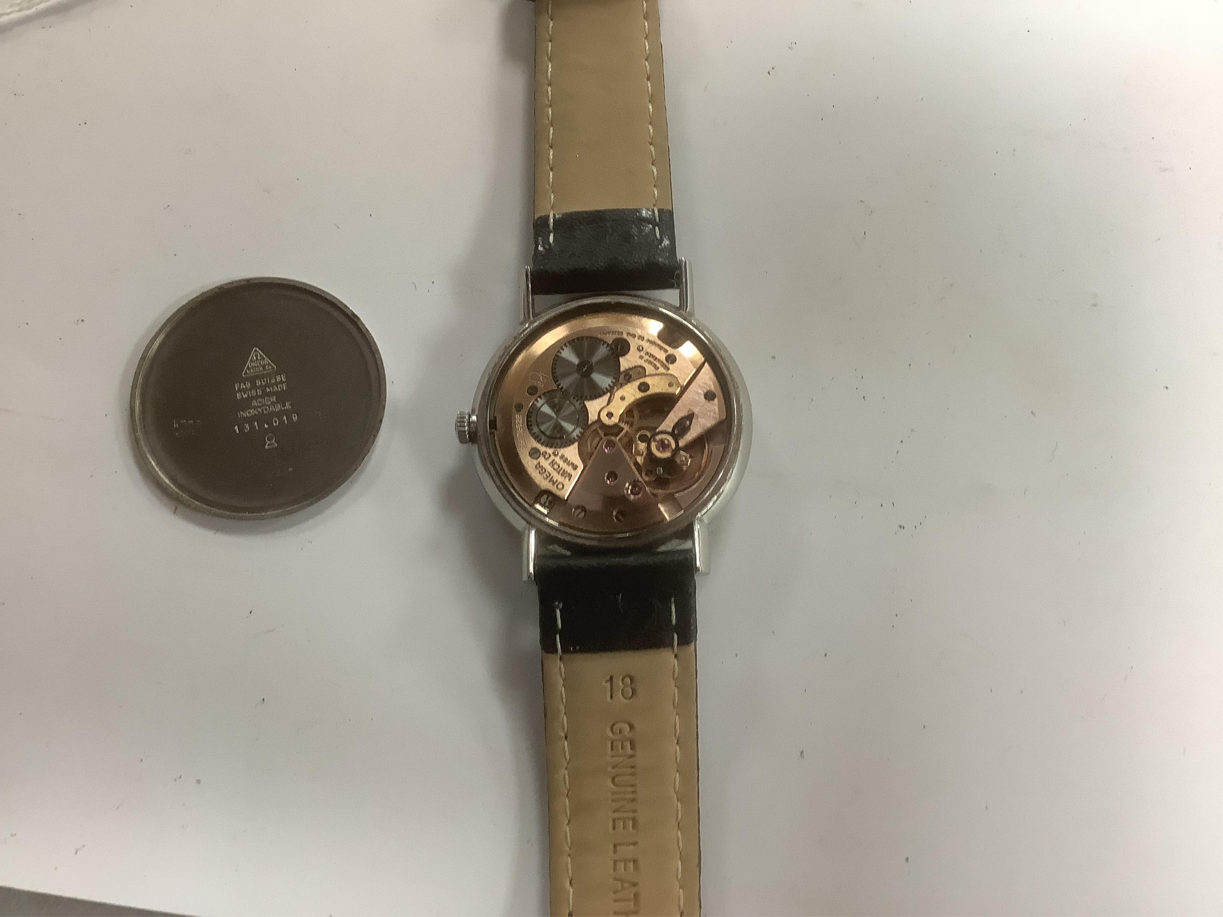 A gentleman's late 1960's stainless steel Omega manual wind wrist watch, with baton and quarterly Arabic numerals, case diameter 34mm, on later associated leather strap, with Omega box.